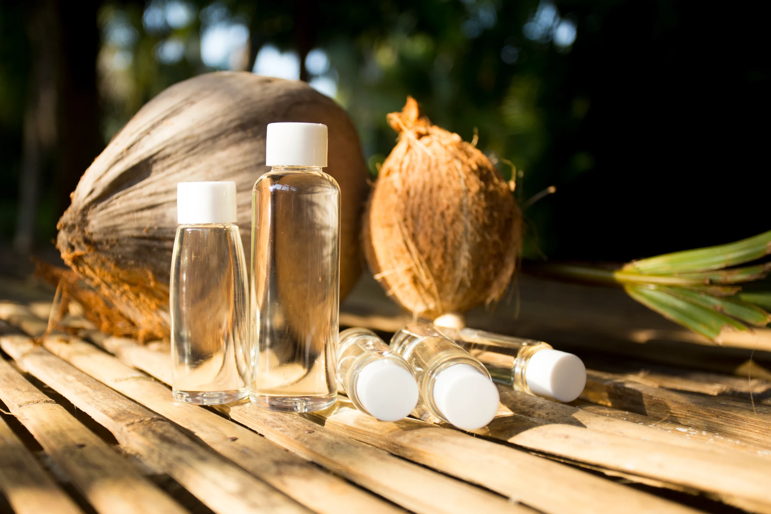High-quality organic coconut oil bottles ready for export by Atrin International
